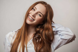 young woman enjoying her ceramic braces